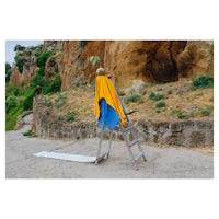 a ladder with a yellow cloth on top of it